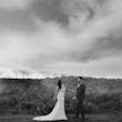 HoBride Wearing Art Deco Wedding Dress Called Luella By Sottero And Midgley Holding Hands With Groom In A Field