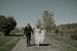 Real Bride in Illusion V-Back Sheath Wedding Gown with Lace Motifs and Side Illusion Panels Called Angie by Rebecca Ingram