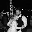 Bride And Groom Dancing Together. Bride Wearing Romantic A-Line Wedding Dress Called Raphael By Maggie Sottero