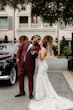 Bride Wearing Lace Mermaid Wedding Gown Called Montgomery By Sottero and Midgley Showing Off Rings with Groom