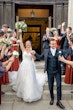 Bride wearing Marvine wedding gown by Sottero and Midgley exiting her ceremony with her husband