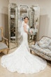 Bride Wearing Beaded Lace Off-the-Shoulder Wedding Gown Called Elias by Sottero and Midgley