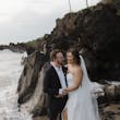 Bride On Beach With Groom In Strapless Wedding Dress Called Monaco By Maggie Sottero
