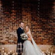 Bride wearing Lettie wedding dress by Rebecca Ingram with her husband