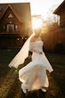 Bride Wearing Pearl Sparkly Wedding Dress Called Drew By Maggie Sottero With The Sun Setting Behind Her