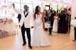 Bride Wearing Sexy Lace Wedding Dress Called Lennon By Maggie Sottero Holding Hands With Groom At The Reception