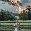 Bride Wearing Sparkly Fit-and-flare Wedding Dress Called Anniston Lane By Maggie Sottero In A Field