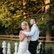 Bride wearing Hattie Lynette by Rebecca Ingram with her husband on a giant chess board