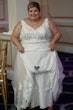 Bride showing her something blue attached to her Lace A-line Wedding Dress called Trinity Lynette by Maggie Sottero
