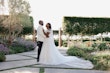 Bride wearing Tatiana wedding dress by Maggie Sottero looking at her husband