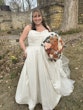 Bride Wearing Sparkly Aline Wedding Dress Called Anniston By Maggie Sottero Holding A Fall Themed Rose Bouquet