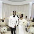 Bride Wearing Simple Fit and Flare Wedding Dress Called Anniston Lane Walking Hand In Hand With Groom