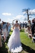Bride Wearing Beaded Lace A-Line Wedding Dress With Flutter Sleeves Paige By Maggie Sottero