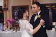 Groom With Bride Wearing White Lace Wedding Dress