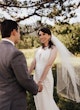 Bride Wearing Sexy Lace Wedding Dress Called Hazel By Rebecca Ingram Holding Hands With Groom