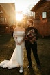 Bride Wearing Pearl Sparkly Wedding Dress Called Drew By Maggie Sottero And Groom Looking At Each Other