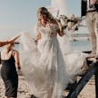 Bride Wearing Off-The-Shoulder Lace Wedding Dress Called Carson By Sottero And Midgley Walking Down The Stairs To The Beach
