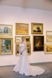 Bride wearing Mitchell Marie Vida by Maggie Sottero in a museum