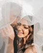 Bride Smiling With Groom With Veil