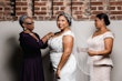 Bride Wearing Chic Crepe Wedding Gown Called Anson By Sottero And Midgley Getting Ready With Her Mother And Sister