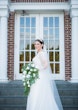 Bride wearing Lorraine Dawn wedding dress by Rebecca Ingram