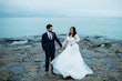 Groom With Bride Wearing Long Sleeve Ball Gown Wedding Dress With A Tiered Organza Skirt Tessa By Rebecca Ingram