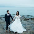 Groom With Bride Wearing Long Sleeve Ball Gown Wedding Dress With A Tiered Organza Skirt Tessa By Rebecca Ingram
