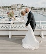 Bride wearing Bethany wedding dress by Rebecca Ingram kissing her husband