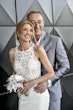 Bride wearing Audrina by Maggie Sottero being held by her husband