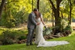 Groom Kissing Bride in Vintage-Inspired Fitted Wedding Dress with Plunging Neckline called Veronique by Maggie Sottero