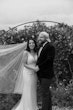 Bride wearing Luella wedding dress by Sottero and Midgley smiling with her husband