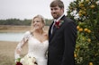 Bride In Off The Shoulder Lace Wedding Dress Called Tiffany By Maggie Sottero With Groom