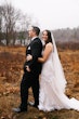 Bride In Lace Beaded Mermaid Wedding Dress Called January By Maggie Sottero With Groom