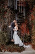 Bride Wearing Beaded Fit-n-flare Wedding Dress Called Jonah Lane By Sottero And Midgley With Groom On A Staircase