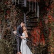Bride Wearing Beaded Fit-n-flare Wedding Dress Called Jonah Lane By Sottero And Midgley With Groom On A Staircase