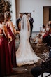 Bride Wearing Beaded Fit-n-flare Wedding Dress Called Jonah Lane By Sottero And Midgley With Groom At The Altar