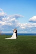 Bride wearing Ulanda wedding dress by Maggie Sottero with groom