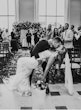 Bride Wearing Beaded Fit-n-flare Wedding Dress Called Jonah Lane By Sottero And Midgley With Groom Kissing Her