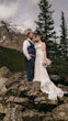 Bride wearing Nelly wedding dress by Rebecca Ingram with her husband