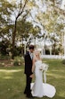 Bride wearing strapless minimalist strapless sheath wedding dress