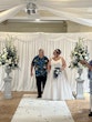 Bride wearing Natasha by Rebecca Ingram walking down the aisle