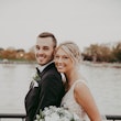Bride with groom wearing affordable sparkly ballgown wedding dress.