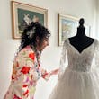 Bride Admiring Her Glam Long Sleeve Wedding Dress Called Seneca By Sottero And Midgley