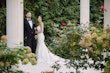 Bride wearing Barcelona by Sottero and Midgley holding her husband's arm