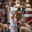 Groom Branding A Rug With Bride In a White Wedding Dress Named Johanna By Maggie Sottero