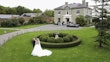 Bride In Lace A-Line Wedding Dress Called Taylor By Maggie Sottero With Long Veil And Groom