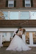 Bride With Bride Wearing Asymmetrical Wedding Gown Winona By Rebecca Ingram