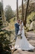 Bride wearing Scarlet by Maggie Sottero being held by her husband