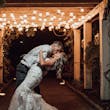 Groom with Bride in Sweetheart Neckline Wedding Dress with Floral Lace Motifs Called Hattie Lane Lynette Marie by Rebecca Ingram