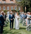 Bride wearing Lorraine by Rebecca Ingram being walked down the aisle